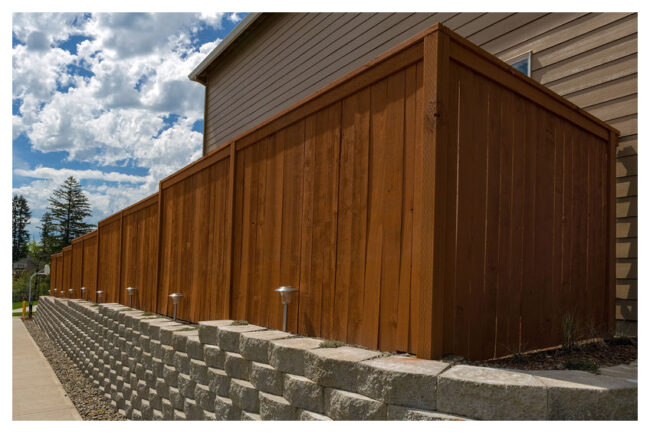Wood Fence and Cement Blocks Retaining Wall