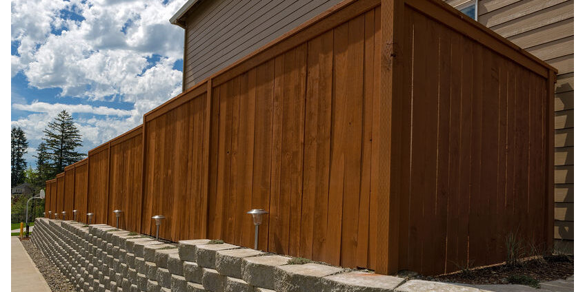 Wood Fence and Cement Blocks Retaining Wall